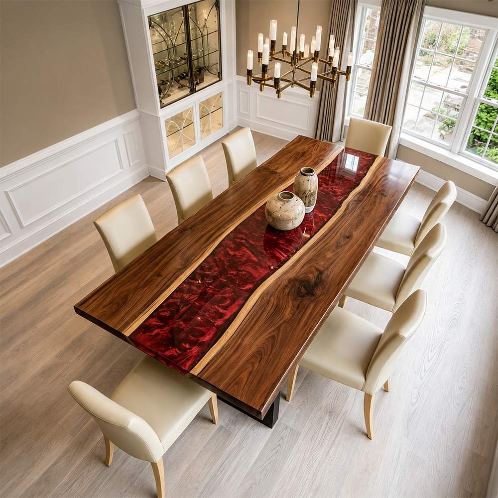 Custom dining table combining solid walnut with flowing ruby-toned resin for an elegant statement piece