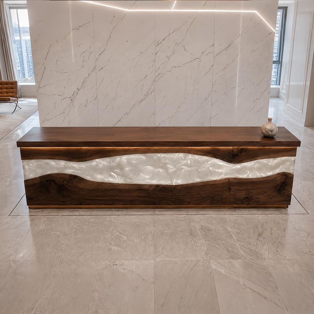 Front view of a long solid black walnut reception desk showcasing a wide, central horizontal pearlescent white swirl epoxy resin river