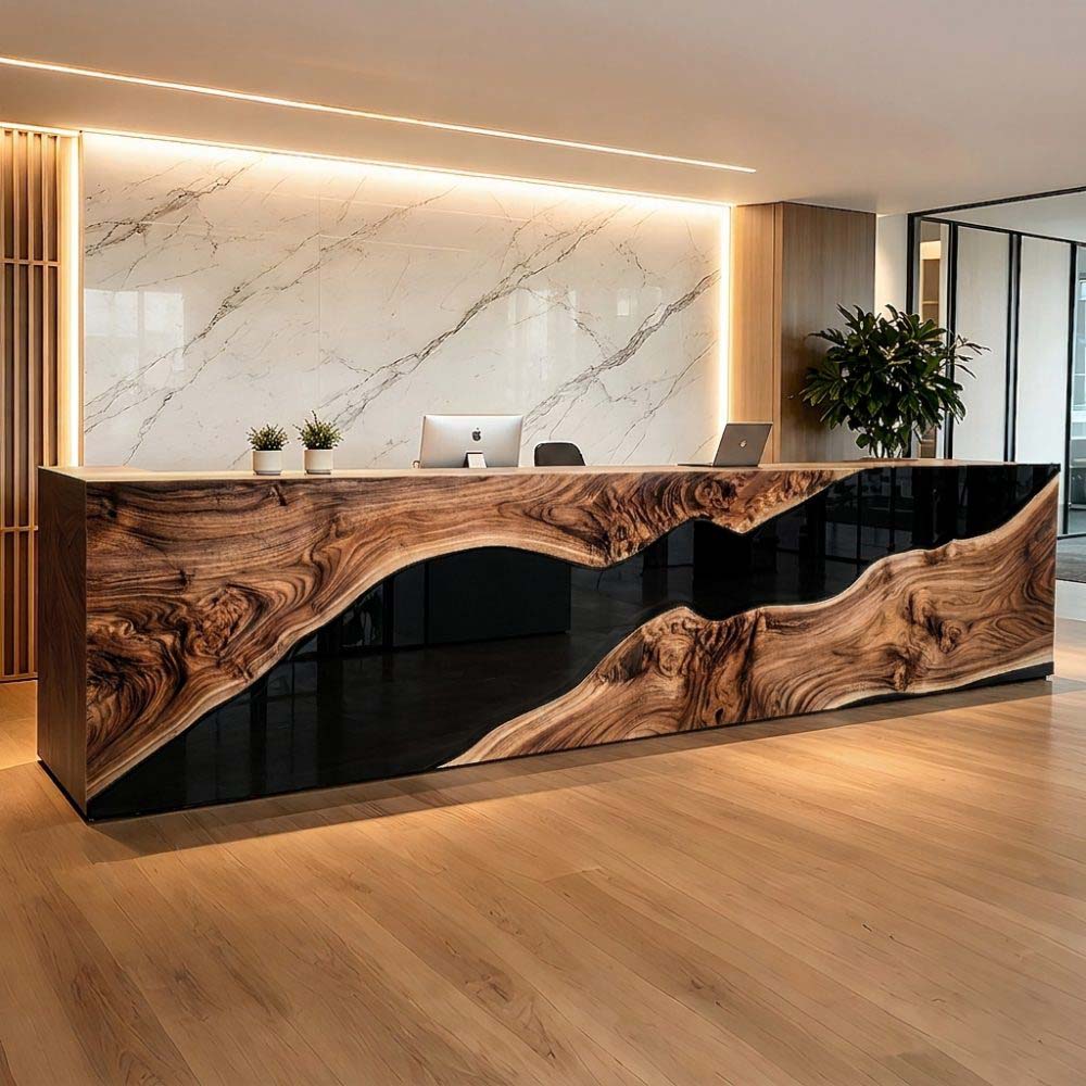Custom walnut reception desk with black resin front panel for a modern office lobby