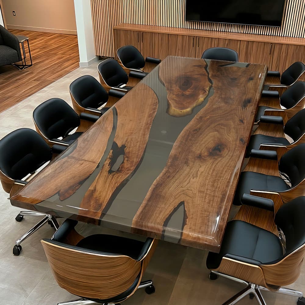 Large live edge black walnut conference table with a smoky gray translucent epoxy resin river in a luxury executive boardroom