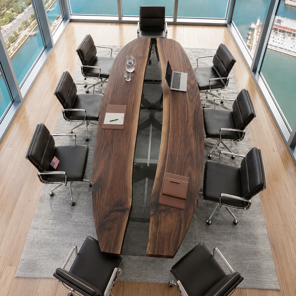 Custom black walnut river conference table designed for executive meeting spaces