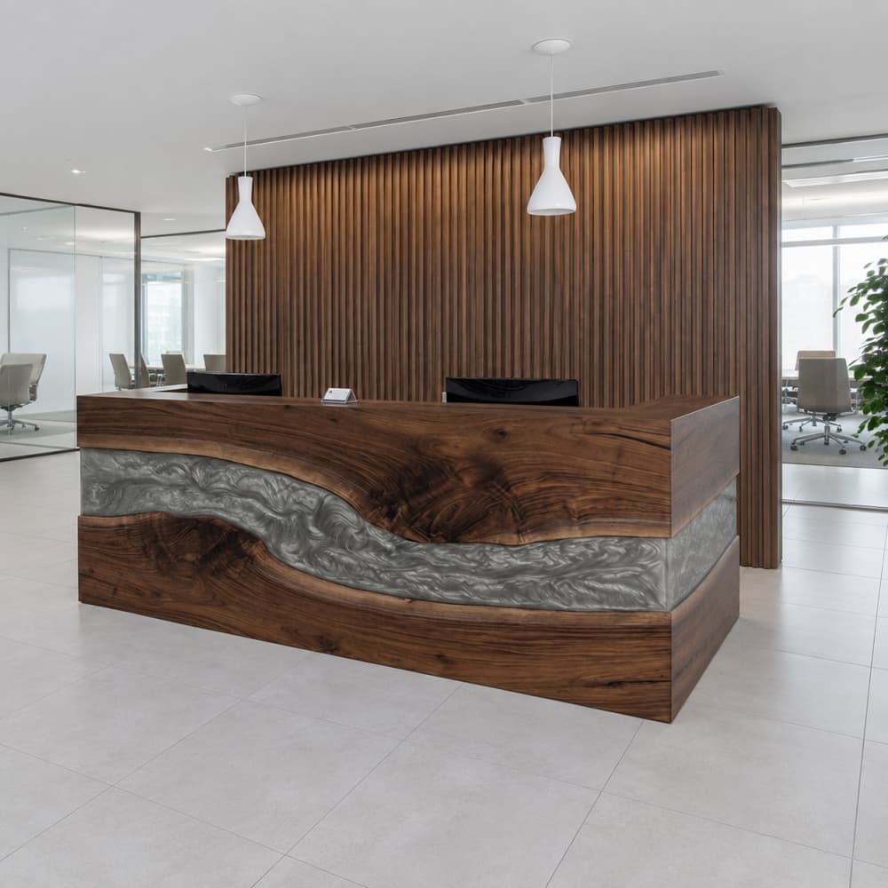 Close-up of the highly figured black walnut wood grain around the live edge, exhibiting deep espresso knots and dark natural swirls
