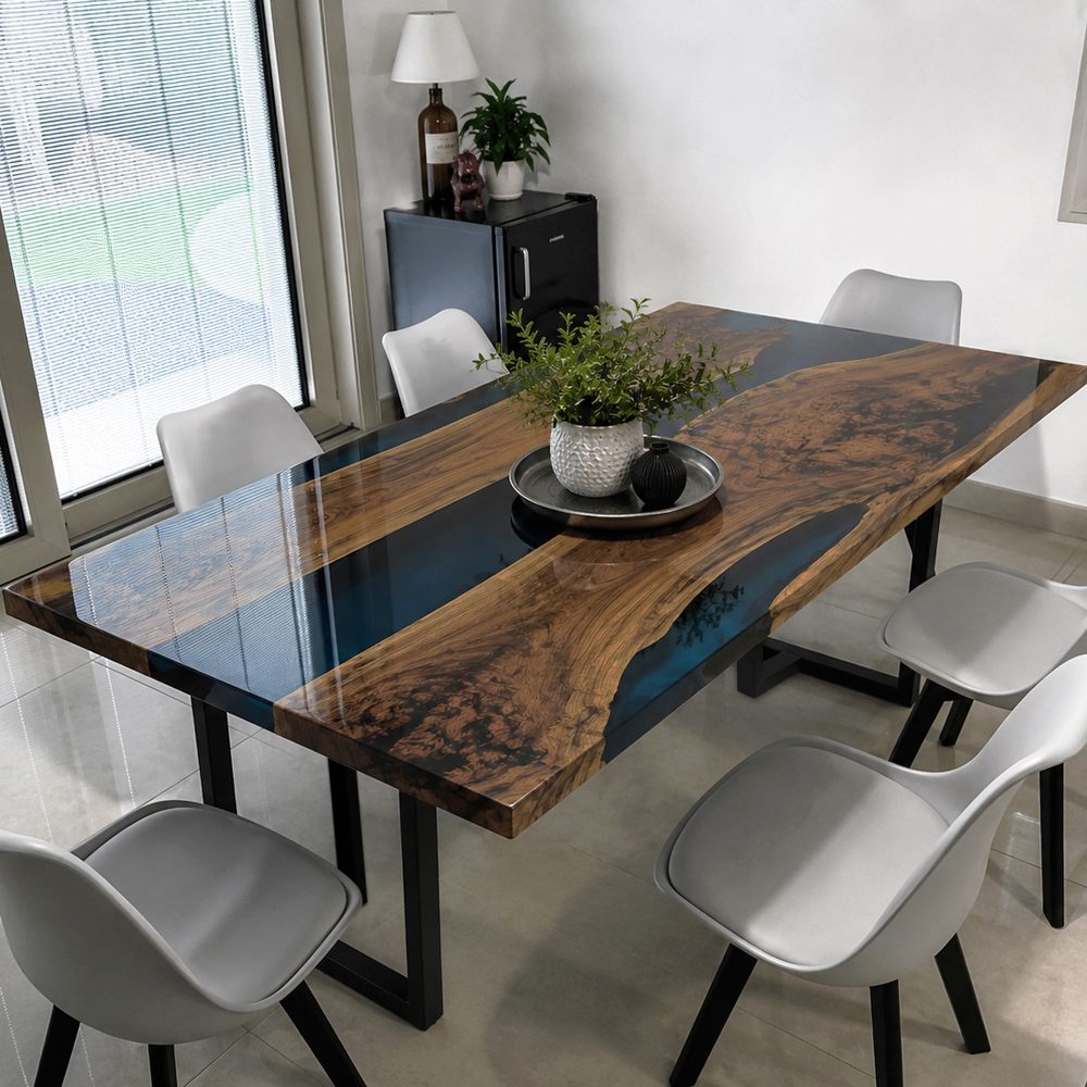 Custom reception lounge table crafted from black walnut and deep blue resin