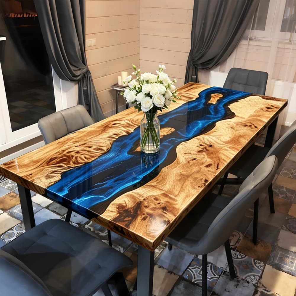 Handcrafted figured maple dining table with flowing blue resin river design.