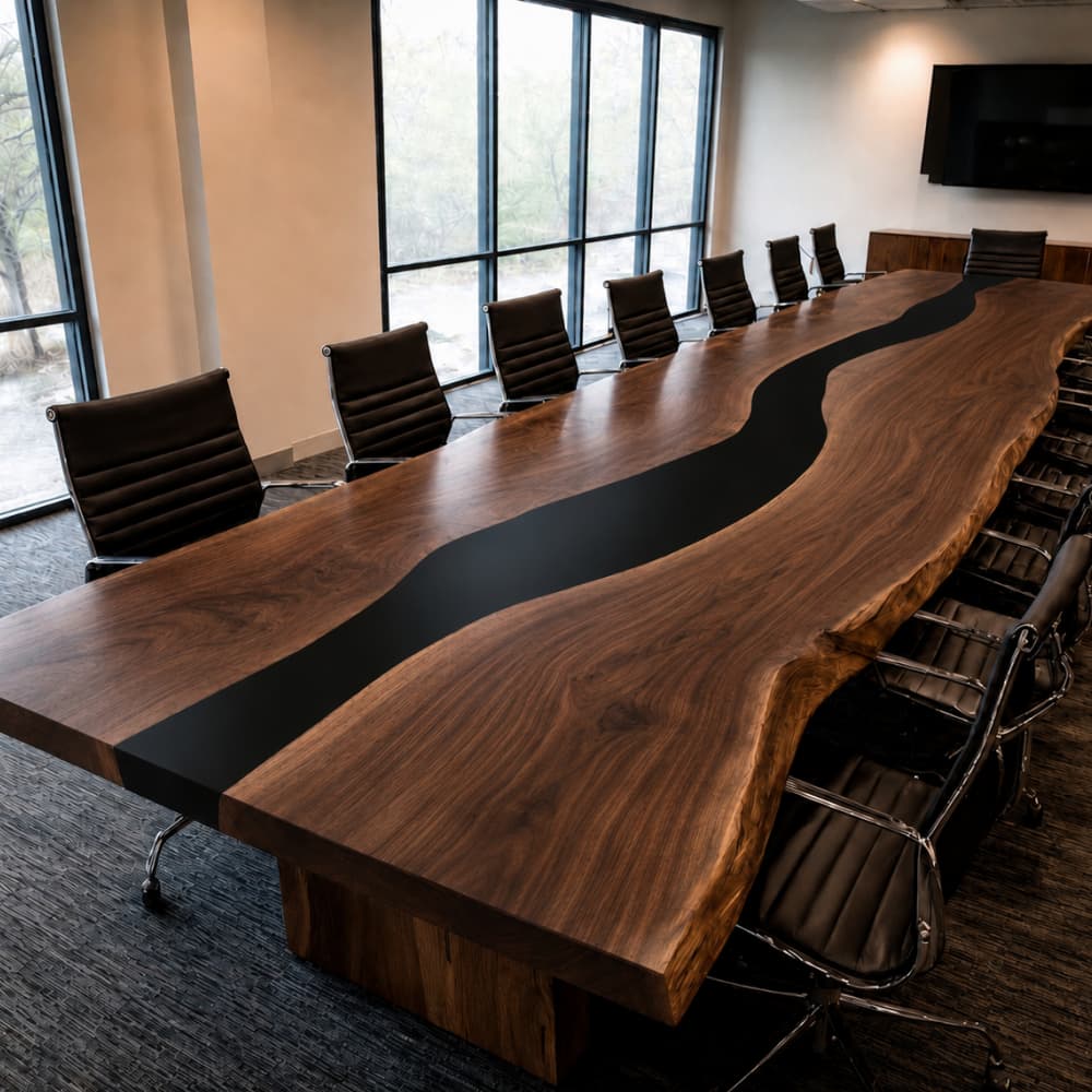 Executive boardroom table crafted from black walnut slabs and black epoxy resin