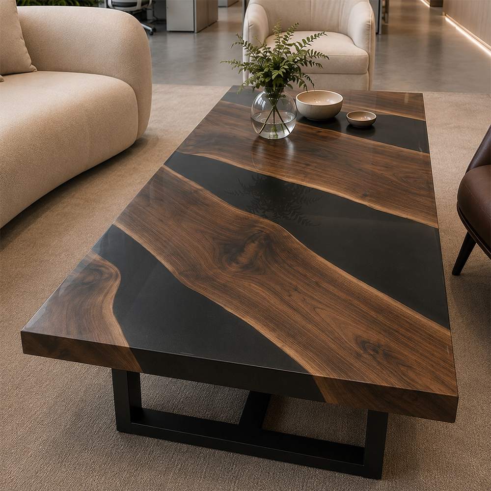 Hand‑made live‑edge walnut black epoxy river coffee table placed inside modern corporate office lounge area with curved sofas