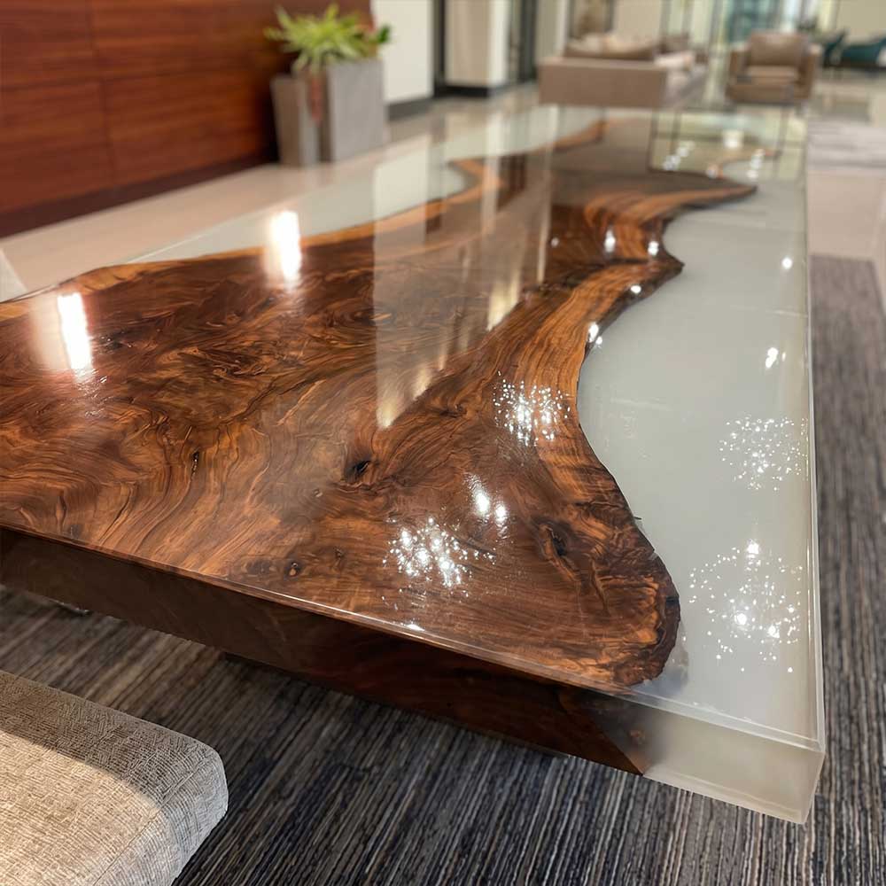 Wooden coffee table with a glass top in a modern living room setting