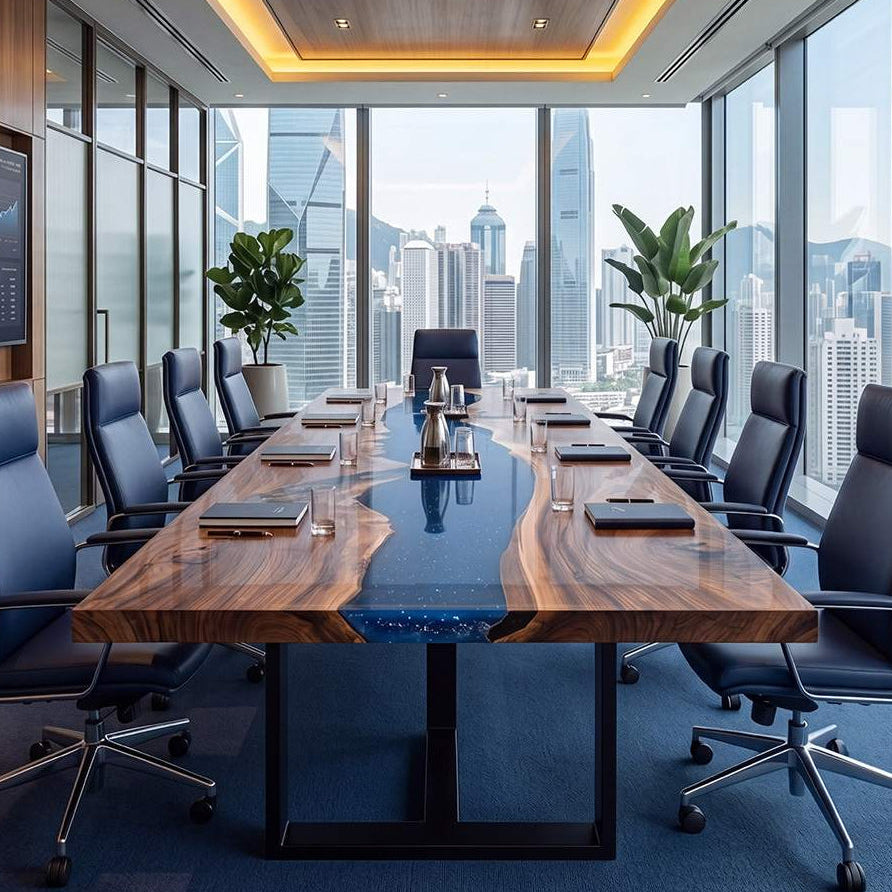Symmetrical view of silver carafes and black notebooks placed neatly on a gloss-finished walnut wood and blue epoxy table
