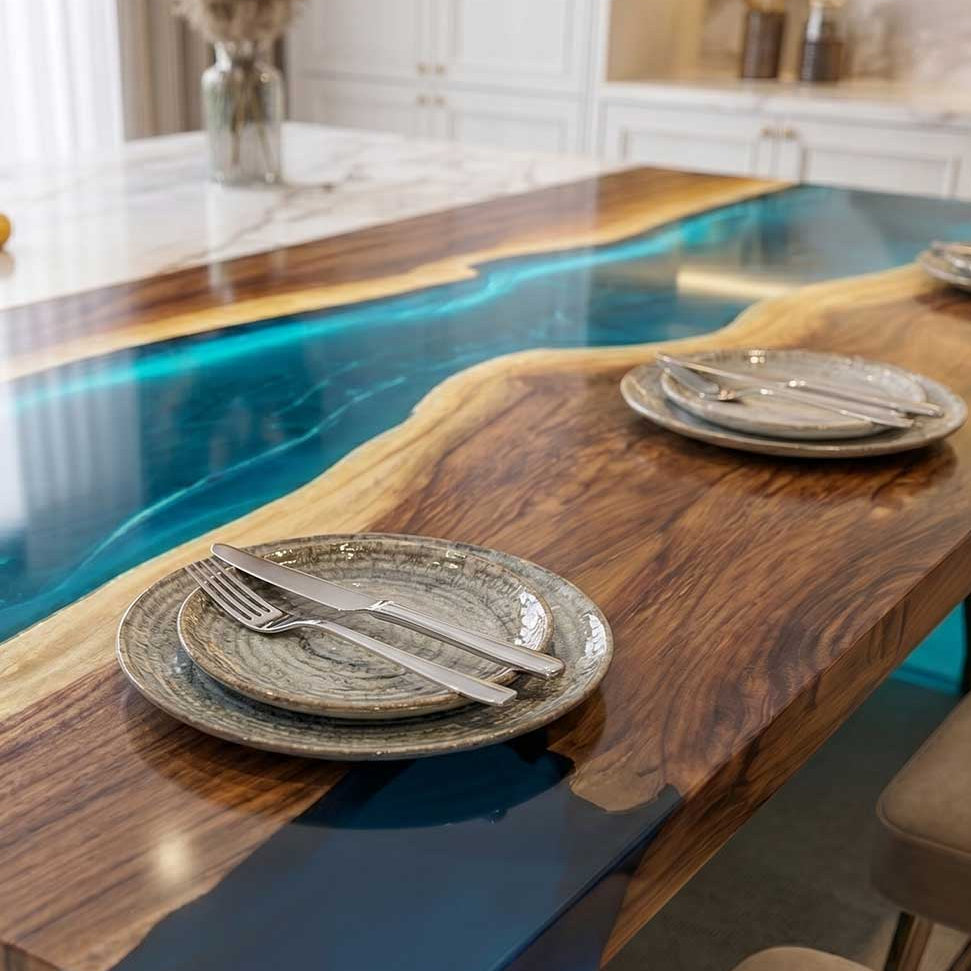 Luxury black walnut waterfall dining table featuring a translucent blue epoxy river