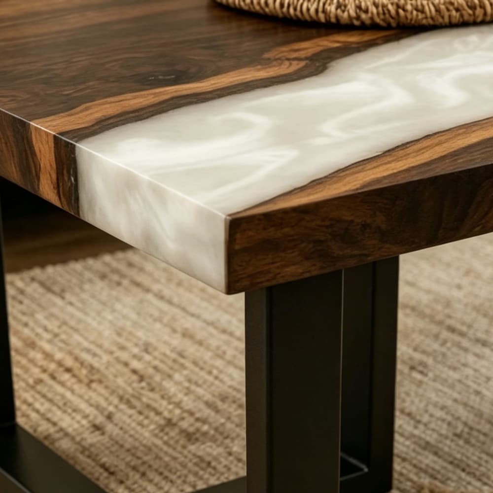 Close-up detail of black walnut wood grain and white swirl epoxy resin tabletop
