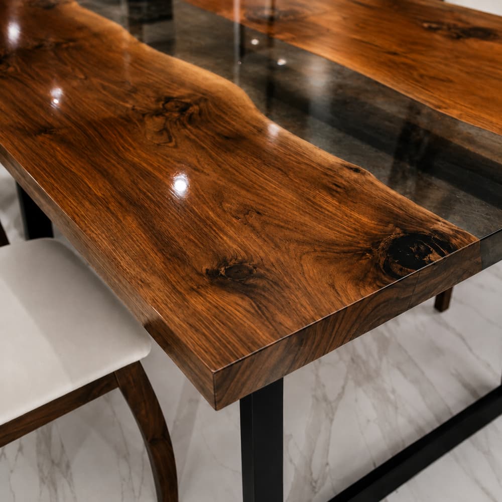 Modern dining table combining natural walnut grain and smoked black resin