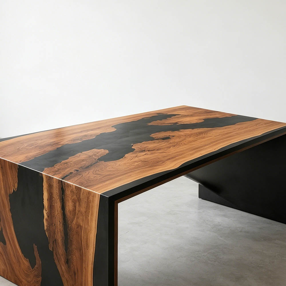 Modern walnut executive office desk with black resin in a bright professional workspace