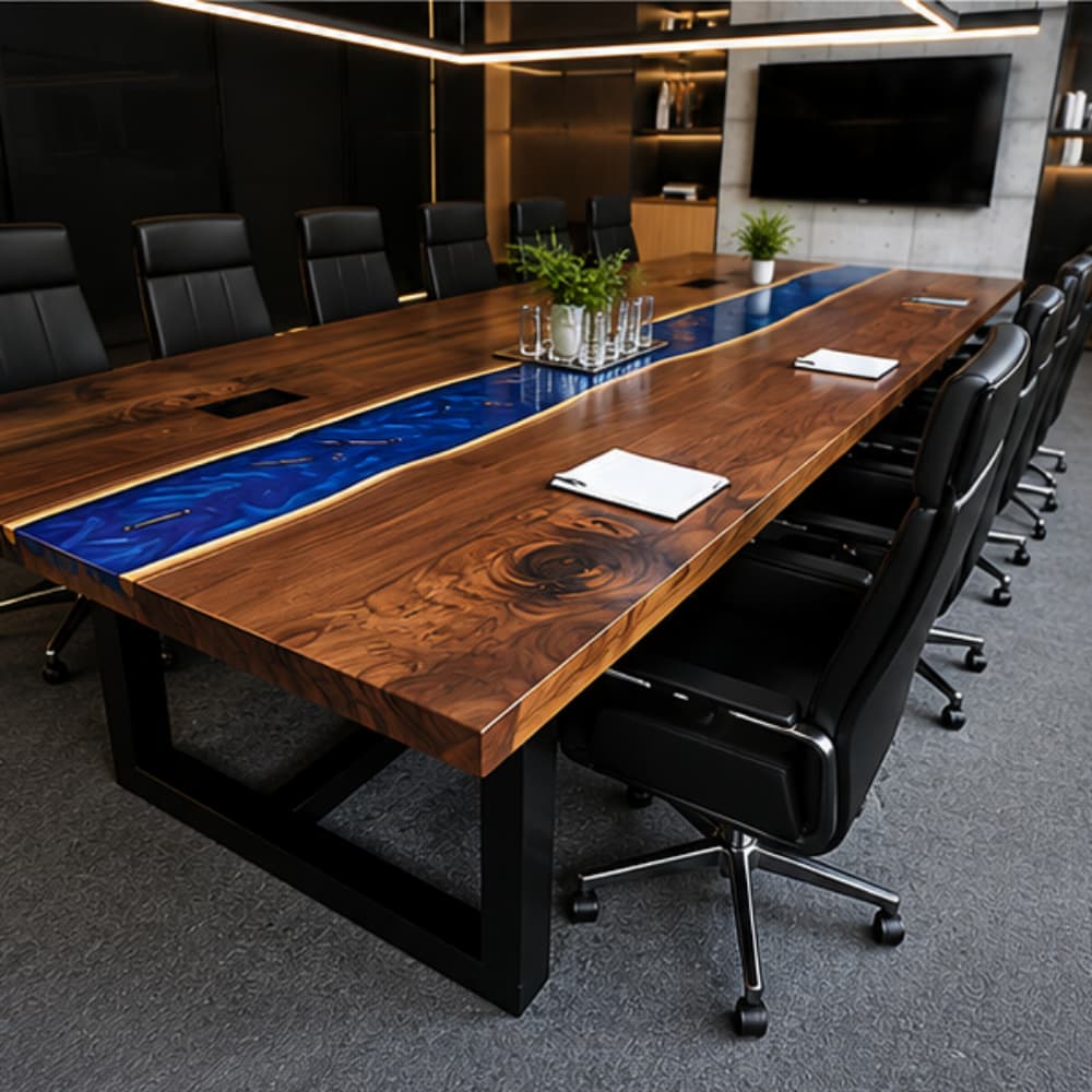 A luxurious boardroom interior featuring a large live edge walnut and blue resin river table, paired with sleek black leather office chairs.