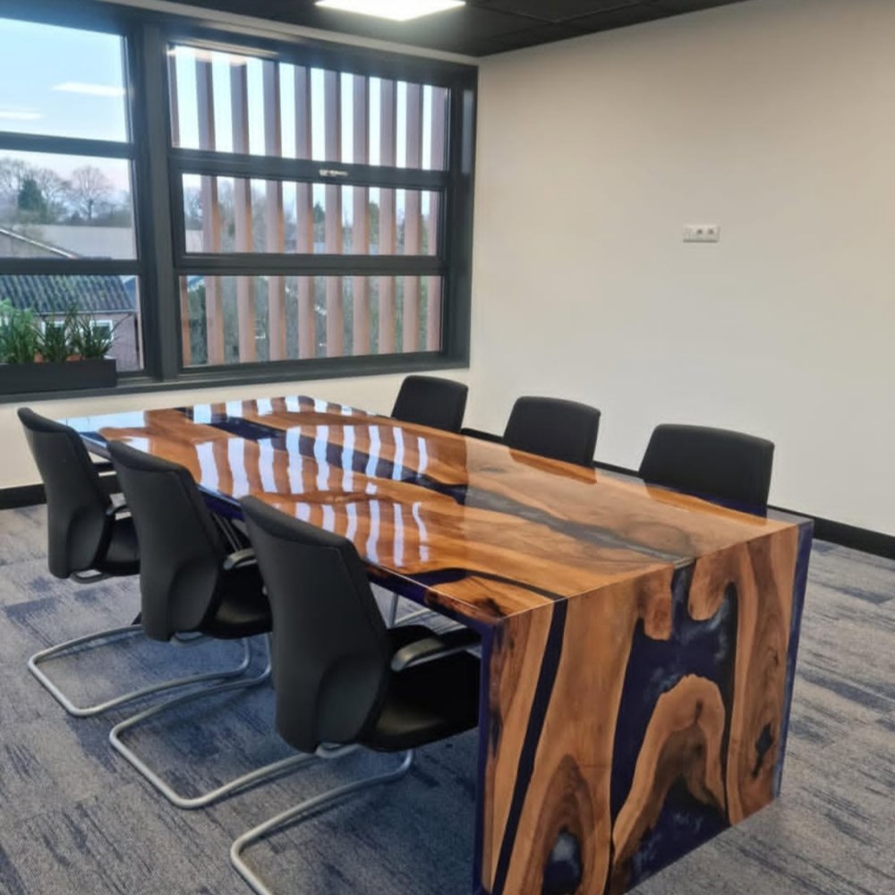 Custom executive meeting table featuring walnut wood and deep purple epoxy waterfall panels